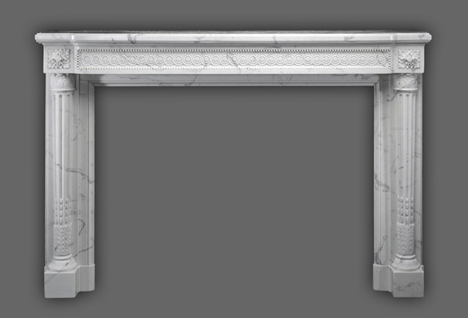 The Versailles Neoclassical style with beautifuly tapered legs on this marble mantel.