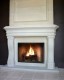 The Napolean cast stone mantel shown with overmantel panels.