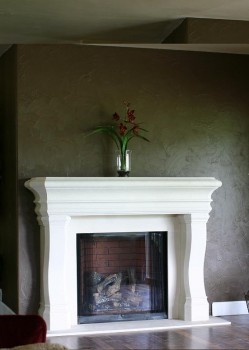 The Napolean thin cast stone fireplace mantel shown with optional facing.