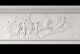 Goddess of the Dawn Aurora leading Sun God Apollo, in the center frieze of this magnificent reproduction marble mantel.