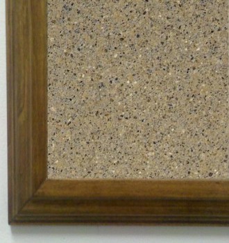 Tan granite tack board with oak frame.