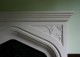 Nice geometric pattern in the spandrel of this Tudor stone mantel