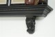 Egg and dart molding with acanthus leaf corbels.