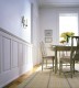 White raised panels wainscoting in dining room.