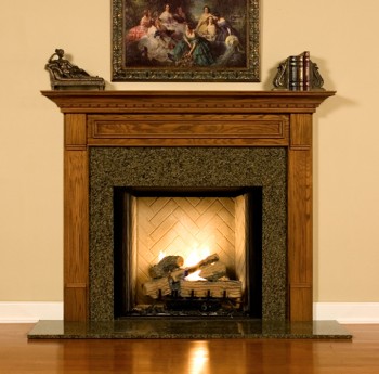 The Hillsboro fireplace mantel is shown here with a granite facing kit.