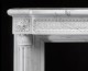 Detail image of the marble mantel breast plate.