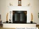 Custom Harrisburg fireplace mantel on raised platform.