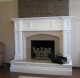Oxford Mantel, new granite facing and a custom Hearth-wrap were featured in this fireplace remodeling project.
