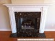 To fit this fireplace/wall the owners cut a rectangular notch in the mantel shelf